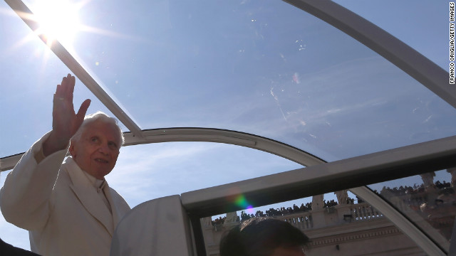 Benedict waves to the faithful. "Loving the church also means having the courage to make tough choices," he said, as he called on the faithful to pray for him and the new pope.