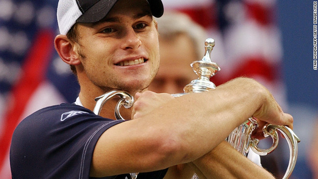 Andy Roddick hugs the U.S. Open trophy after winning his first grand slam title in September 2003.