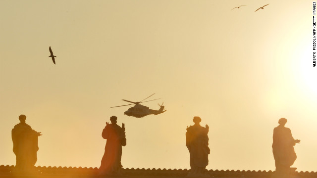 The helicopter with Pope Benedict XVI aboard flies past St. Peter's Square.