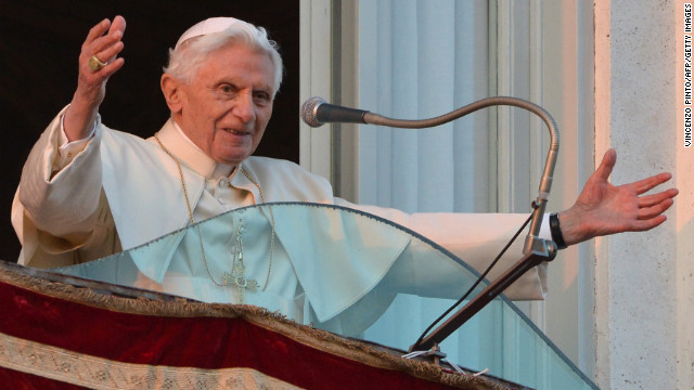 Pope Benedict XVI waves to the crowd from a balcony upon his arrival in Castel Gandolfo.