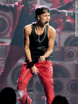 Bieber cleans up at the American Music Awards in November, but <a href='http://marquee.blogs.cnn.com/2012/12/06/grammy-snubs-bieber-gets-the-cold-shoulder/'>the young artist is left out completely</a> when the Grammy nominations are announced a few weeks later. Add <a href='http://www.cnn.com/2012/12/13/us/justin-bieber-murder-plot'>an alleged murder plot</a> to the mix, and it's fair to say December 2012 wasn't the best month for the Biebs. 