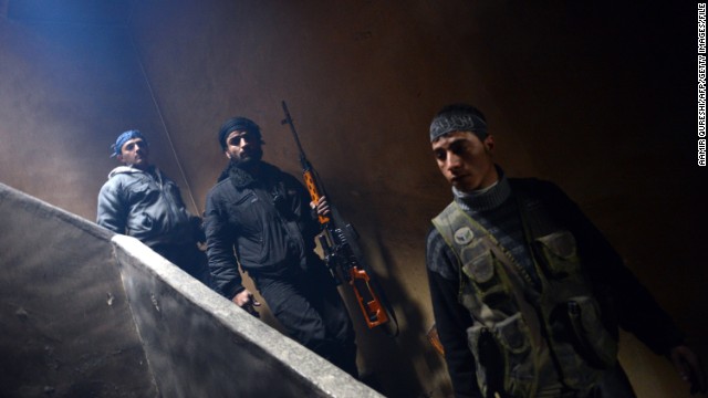 Rebel fighters take position to fight against pro-government forces in Aleppo on February 9, 2013.