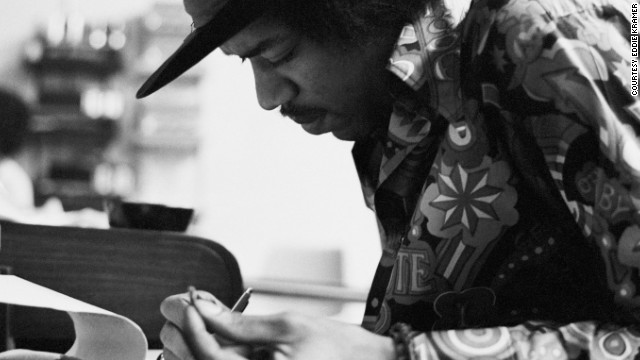 <strong>Hendrix at the Record Plant in 1968:</strong><!-- -->
</br>"Jimi had the habit of making the final draft of a song he was working on just before he went into the booth to record the vocal. This photo shows a smiling Jimi putting the final touches to 'Gypsy Eyes' from the many notes he kept with him usually written on hotel stationery, napkins or matchbook covers. These would be assembled on a yellow legal pad just prior to singing the final vocal. An interesting observation is that he wrote right-handed even though he played lefty." --<i> Eddie Kramer</i>