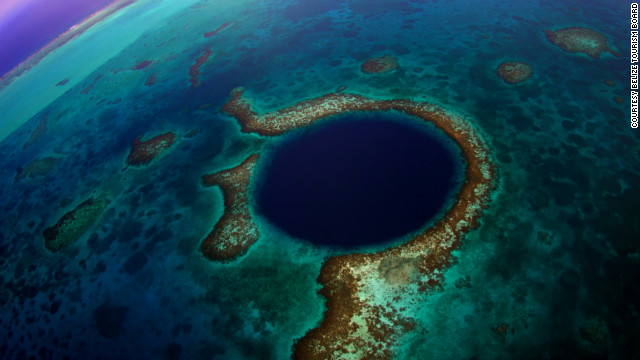 "The Great Blue Hole" is the name of a massive underwater sinkhole off the coast of Belize. The deeper you go, the clearer the water becomes, revealing amazing stalactites and limestone.