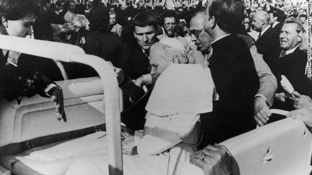 Pope John Paul II is shot by would-be assassin Mehmet Ali Agca in St. Peter's Square on May 13, 1981. Following the assassination attempt, the Popemobile was equipped with bullet-proof glass.