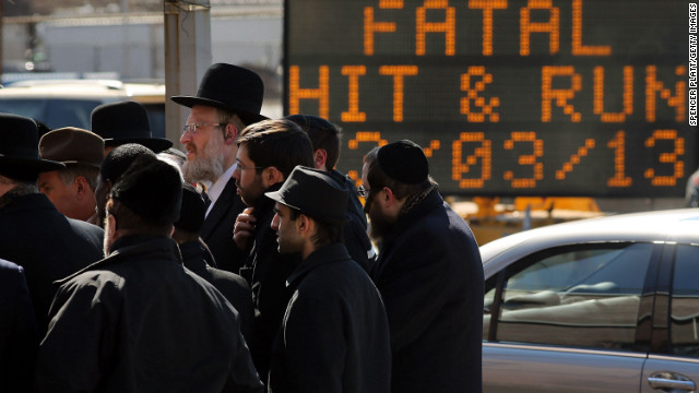 Members of the Brooklyn Orthodox Jewish community attend a news conference Monday, March 4, after an Orthodox couple died in a hit-and run-crash on Sunday. The day after the crash killed them, it claimed another life: their newborn son.