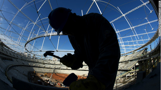 A worker swings a hammer inside 'Arena Fonte Nova' stadium in Salvador de Bahia, Brazil on December 6, 2012 before next June's eight-nation Confederations Cup.