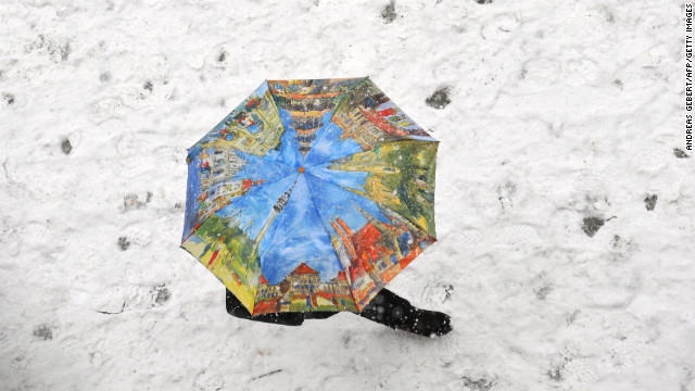 A person walks through the snow at Marienplatz in Munich, Germany, on February 26.