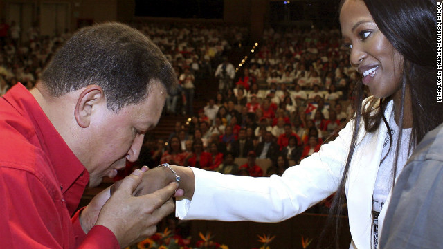 Chavez kisses the hand of British supermodel Naomi Campbell during a meeting in Caracas on October 31, 2007.