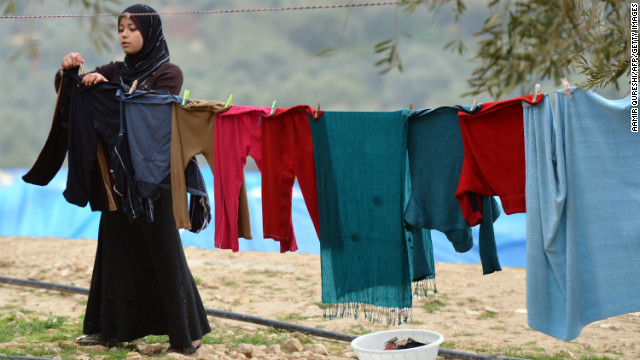 Clothes dry at the Qah refugee camp near the Turkish border on January 31. Many Syrians are forced to flee with few or no belongings.