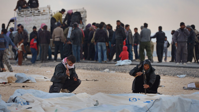 Syrians put up tents at the Zaatari refugee camp on January 30.