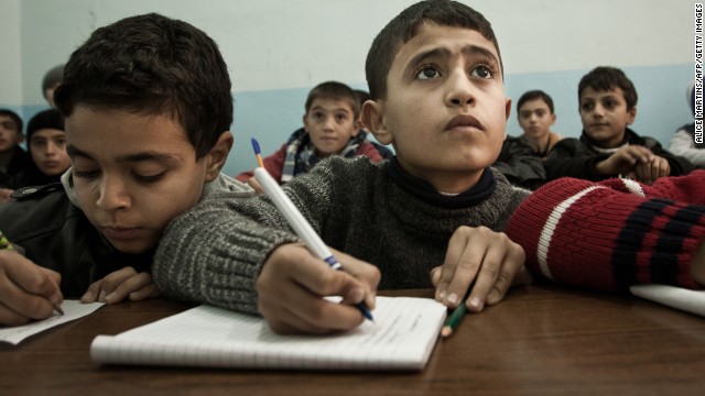 A Syrian boy attends school in the Turkish town of Kilis on December 17, 2012.