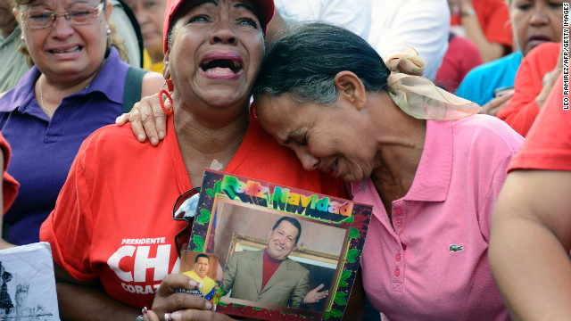 Supporters of the late Venezuelan President Hugo Chavez cry in Caracas, a day after his death on March 6, 2013.