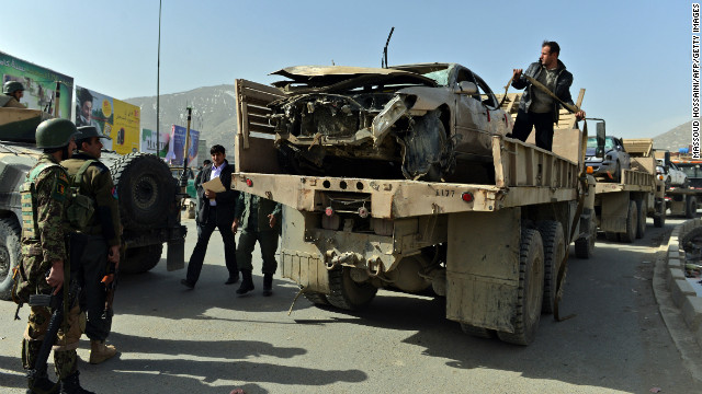 Afghan police officer hugs suicide bomber