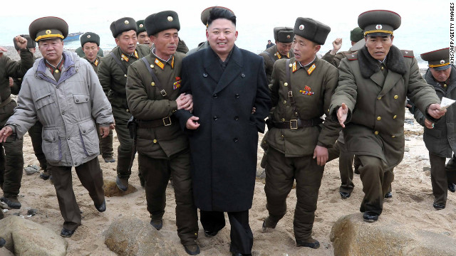 Kim is surrounded by soldiers during a visit to the Mu Islet Hero Defense Detachment near South Korea's Taeyonphyong Island on March 7. North Korea has escalated its bellicose rhetoric, threatening nuclear strikes, just before the U.N. Security Council passed tougher sanctions against the secretive nation on March 7.