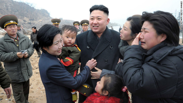 Kim is greeted by the family of a soldier as he inspects Jangjae Islet Defense Detachment near South Korea's Taeyonphyong Island in South Hwanghae province on Thursday, March 7, in a photo from the state-run Korean Central News Agency.