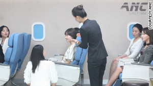At ANC flight attendant academy in Seoul, students practice role-playing in a classroom simuating a plane.