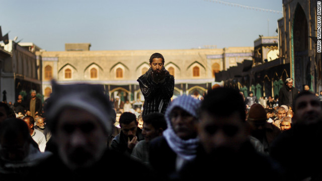 Shiite worshipers pray during an Ashura commemoration ceremony at the Kadhimiya shrine in Baghdad on December 6, 2011. Ashura marks the death of Prophet Mohammed's grandson, the revered Imam Hussein.