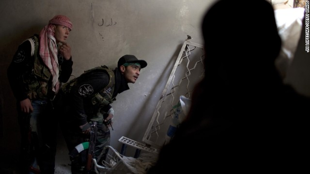 Syrian rebels take position in Aleppo, the largest city in the country, on March 11.