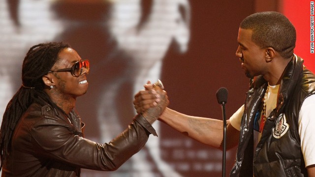 Rapper Lil Wayne, left, congratulates Kanye West on his Best Male Hip Hop Artist win onstage during the 2008 BET Awards at the Shrine Auditorium on June 24, 2008, in Los Angeles.