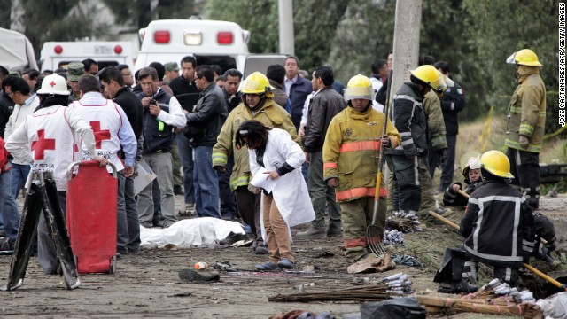 Rescue workers at the scene of a fireworks explosion in Jesusito Nativitas, Tlaxcala, Mexico, March 15, 2013. 