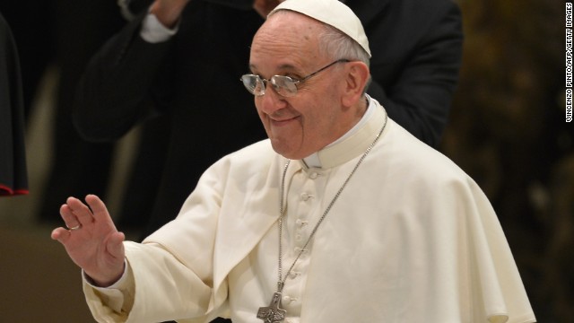 Pope Francis waves to members of the media upon his arrival for a private audience Saturday at the Vatican.