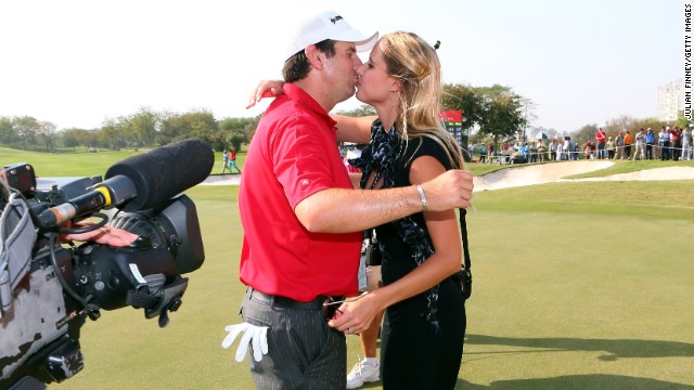 Thomas Aiken of South Africa celebrates with wife Kate after winning the Avantha Masters in India.