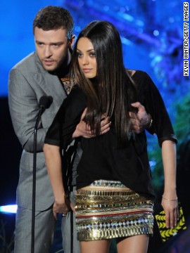 Timberlake presents an award with his "Friends with Benefits" co-star Mila Kunis during the 2011 MTV Movie Awards.