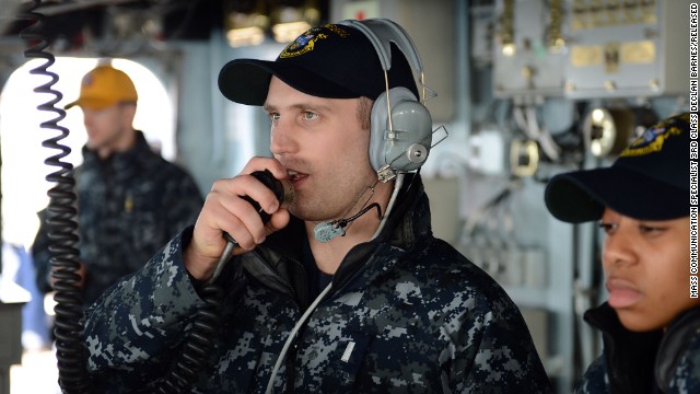 In this Navy handout image taken on March 5, Lt.j.g. Matthew Harmon serves as helm safety officer aboard the guided-missile destroyer USS McCampbell during a replenishment-at-sea, part of Foal Eagle 2013, the joint exercises between the United States and South Korea.