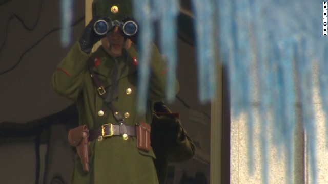 One North Korean soldier observes us closely with his binoculars through the icicles.