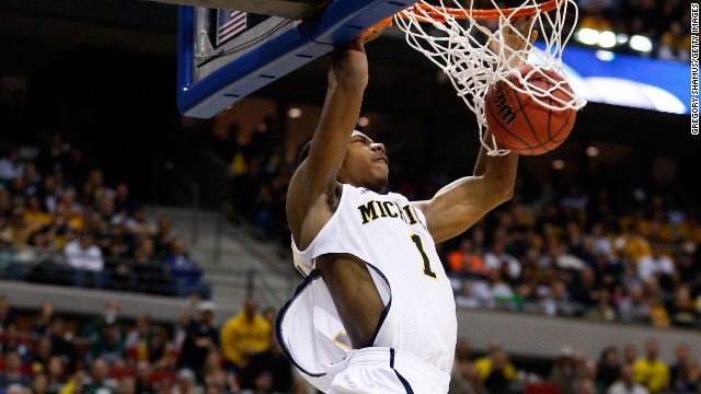 Glenn Robinson III of the Michigan Wolverines dunks against the Virginia Commonwealth Rams on March 23. Robinson's jersey was ripped during play.