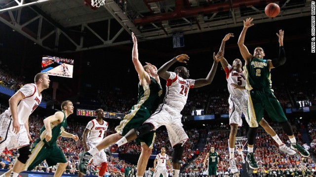 Daniel Bejarano of the Colorado State Rams, right, and Kevin Ware, second from right, of the Louisville Cardinals go up for a rebound on March 23 in Lexington, Kentucky. The Cardinals won 82-56.