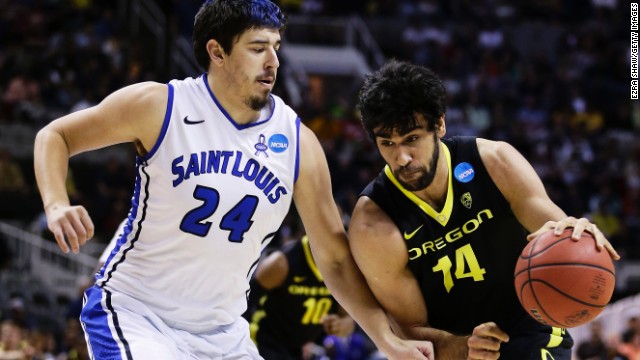 Arsalan Kazemi of the Oregon Ducks, right, drives against Cody Ellis, left, of the Saint Louis Billikens on March 23 in San Jose. Oregon won 74-57. 