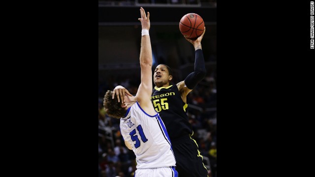 Tony Woods of Oregon goes up for a shot over Rob Loe of Saint Louis on March 23.