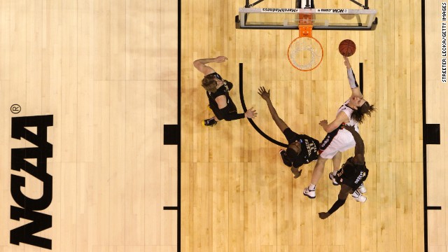 Kelly Olynyk of Gonzaga goes up for a shot against Cleanthony Early, second from left, and Ehimen Orukpe, right, of Wichita State on March 23.