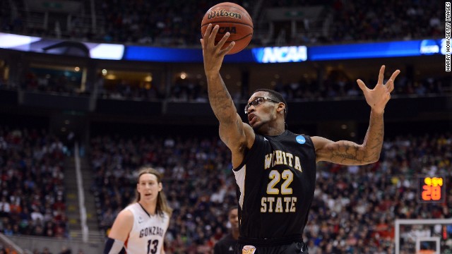 Carl Hall of Wichita State, right, catches a pass in front of Kelly Olynyk, left, of Gonzaga on March 23. Marquette defeated Butler 74-72.