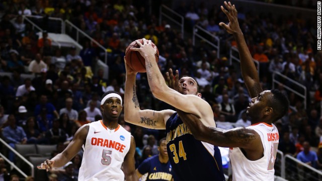 Rakeem Christmas of Syracuse, right, defends against Robert Thurman, center, of California on March 23.