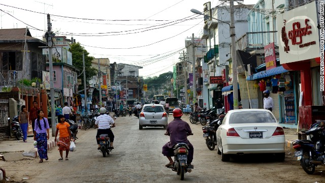 Scooters zip down the road in Pyinmana, a logging town and sugar refinery center near the new capital, Naypyidaw. The capital moved from Yangon to Naypyidaw in 2005.