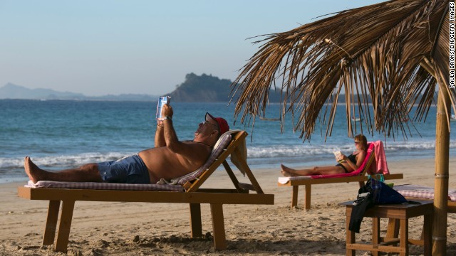 The diverse culture of Myanmar has increasingly drawn tourists to its historic landmarks and warm beaches. Here, tourists sun themselves along Ngapali Beach in the Southeast Asian country. Click through to see more of what to expect when visiting Myanmar, also known as Burma.