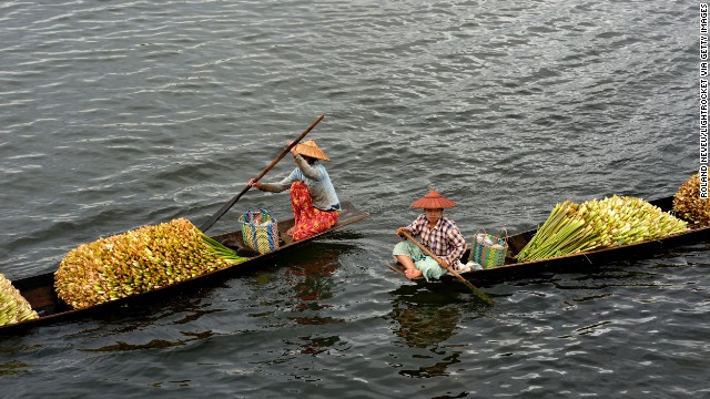 People transport flowers across Inle Lake, a large freshwater lake. 