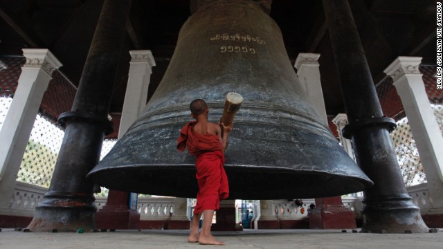 A novice monk rings the Mingun Bell, the world's third-largest bell, in Mingun village, about 21 kilometers (13 miles) southwest of Mandalay.