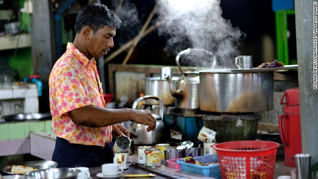 A Burmese man of Indian descent makes tea in a stall in Mawlamyine.