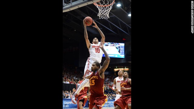 LaQuinton Ross of Ohio State drives to the basket against Korie Lucious, bottom center, of Iowa State on March 24.