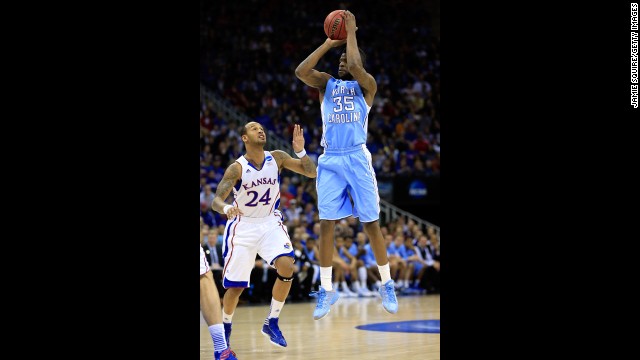 Reggie Bullock of North Carolina attempts a shot against Travis Releford of Kansas on March 24.