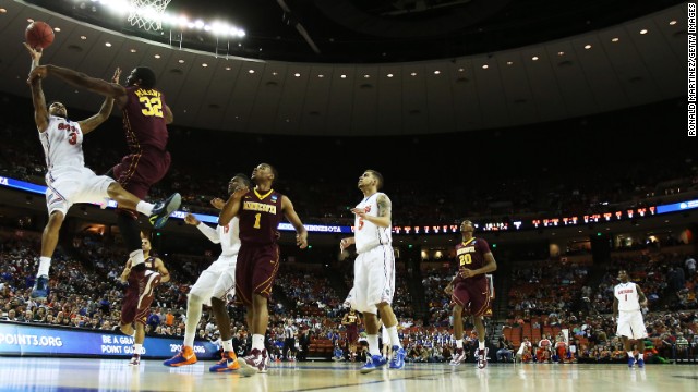 Mike Rosario of Florida, left, goes up against Trevor Mbakwe of Minnesota on March 24.