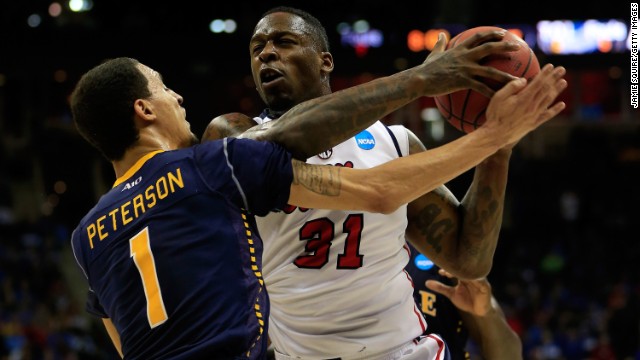 Murphy Holloway of the Ole Miss Rebels drives against D.J. Peterson of the La Salle Explorers on March 24 in Kansas City, Missouri. La Salle won 76-74.