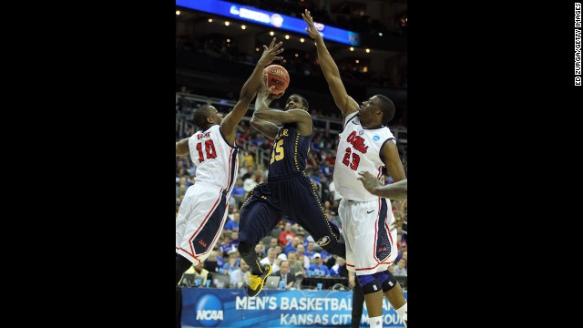 Ramon Galloway of La Salle shoots over against Ladarius White, left, and Reginald Buckner of Ole Miss on March 24.