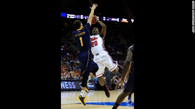 Nick Williams of Ole Miss attempts a shot against D.J. Peterson of La Salle on March 24.