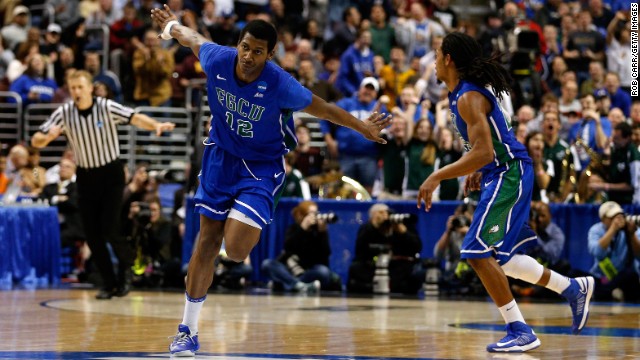 Eric McKnight, left, of the Florida Gulf Coast Eagles celebrates in the second half while taking on the San Diego State Aztecs on March 24 in Philadelphia. Florida Gulf Coast won 81-71.