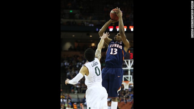 Tracy Abrams of Illinois shoots over Shane Larkin of Miami on March 24.